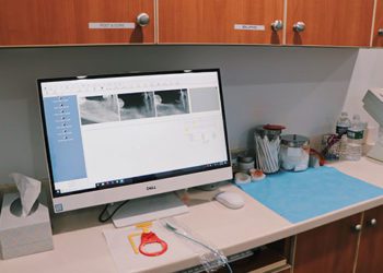 A computer monitor sitting on top of a desk.